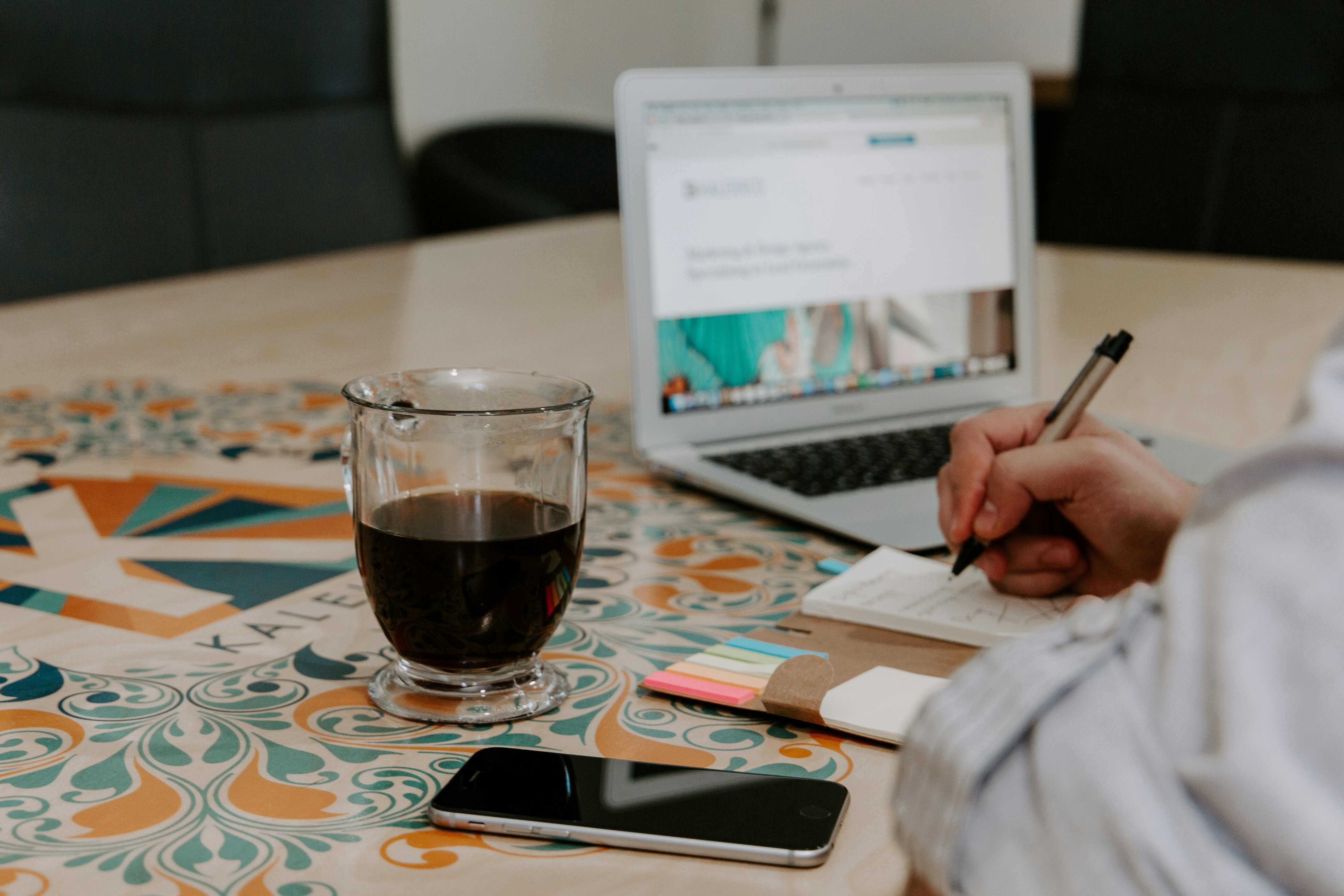 Taking notes with coffee and computer