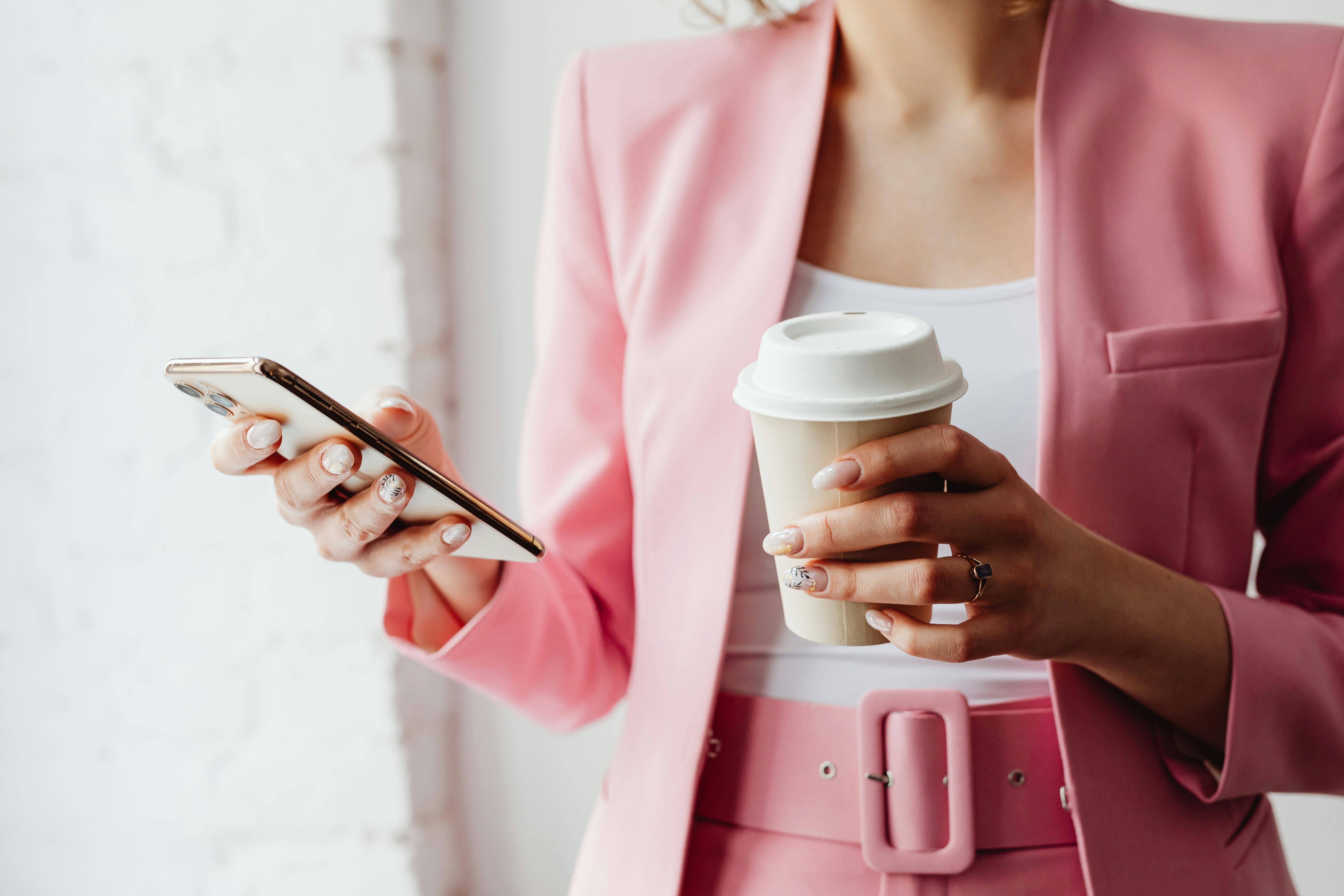 Female worker monochromatic pink business outfit business calls